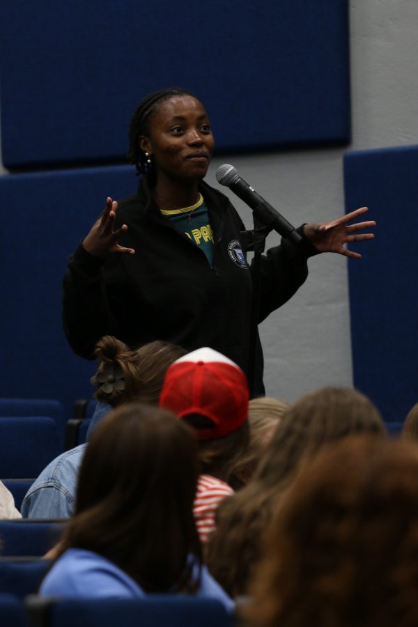 A student asking a question at the open mic